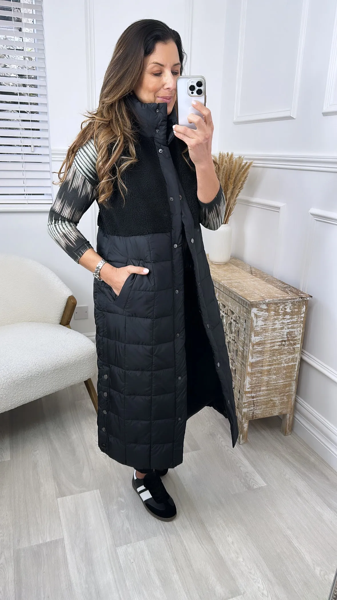 Here is an optimized title for the product: Molly Black Quilted Teddy Gilet Vest - Cozy and Stylish Layer for Women