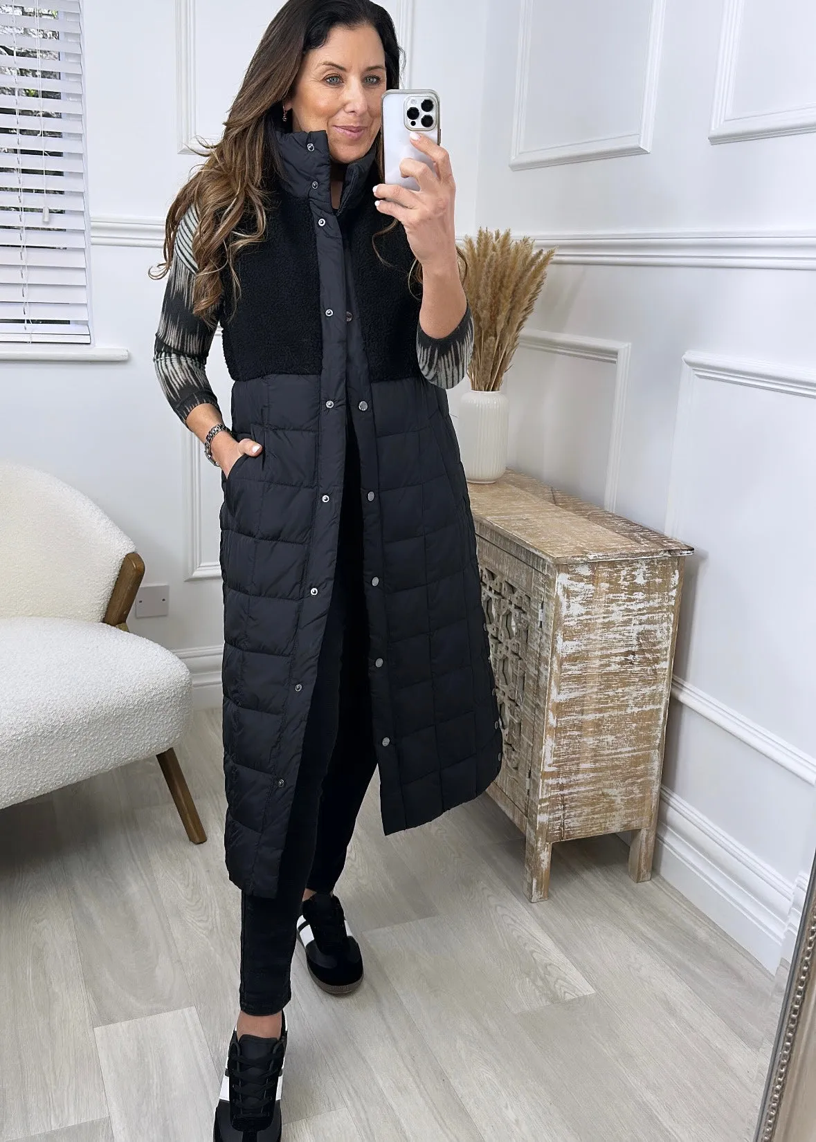 Here is an optimized title for the product: Molly Black Quilted Teddy Gilet Vest - Cozy and Stylish Layer for Women